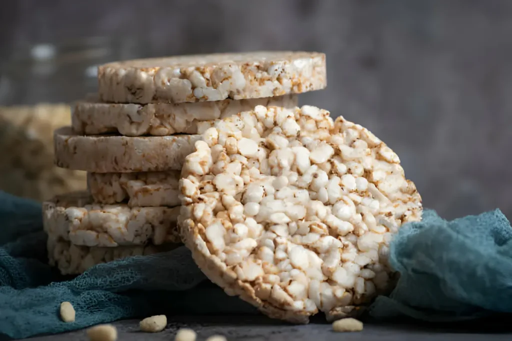 Fresh homemade rice cakes with toppings on a wooden table